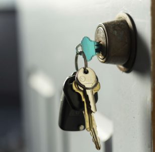 House keys locking a door to secure the property