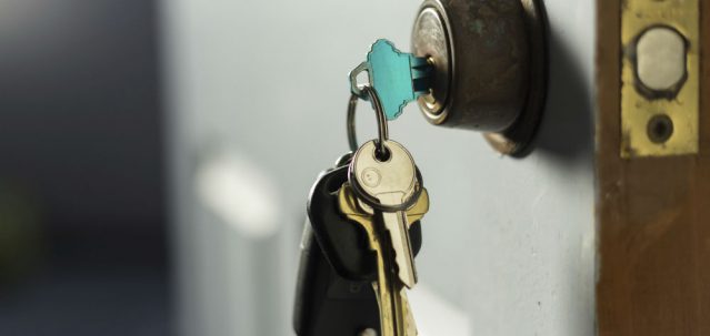 House keys locking a door to secure the property