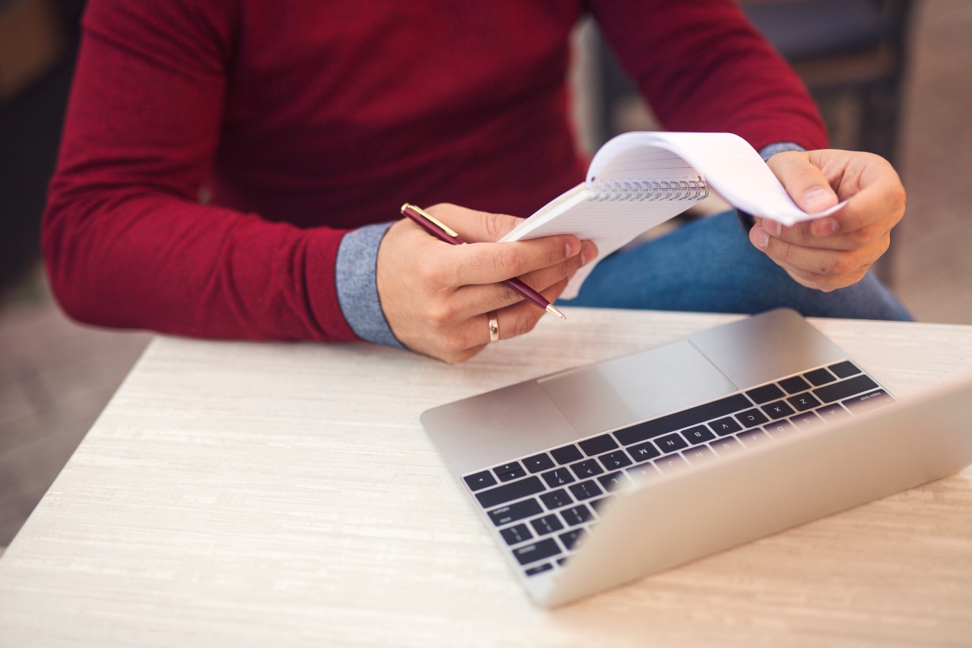 man with laptop and notepad