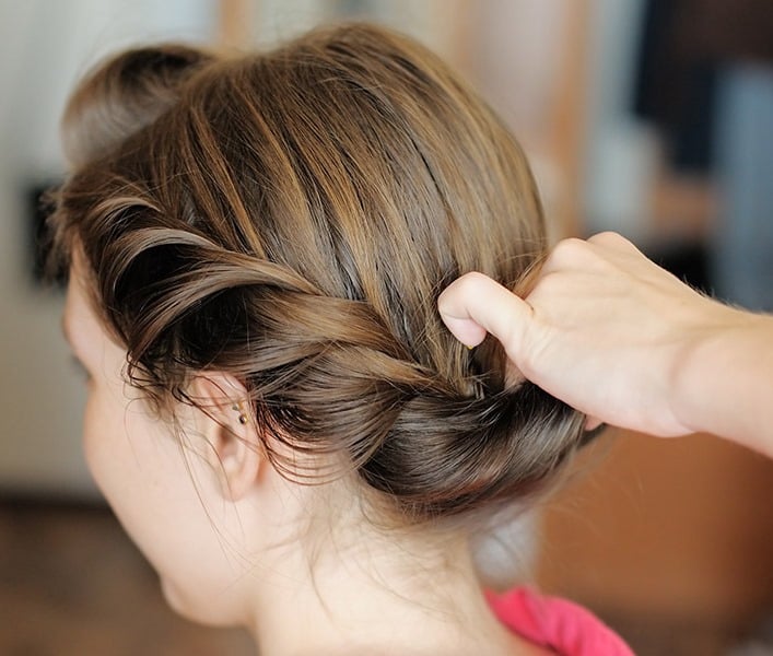 A hairdresser styling a customer's hair