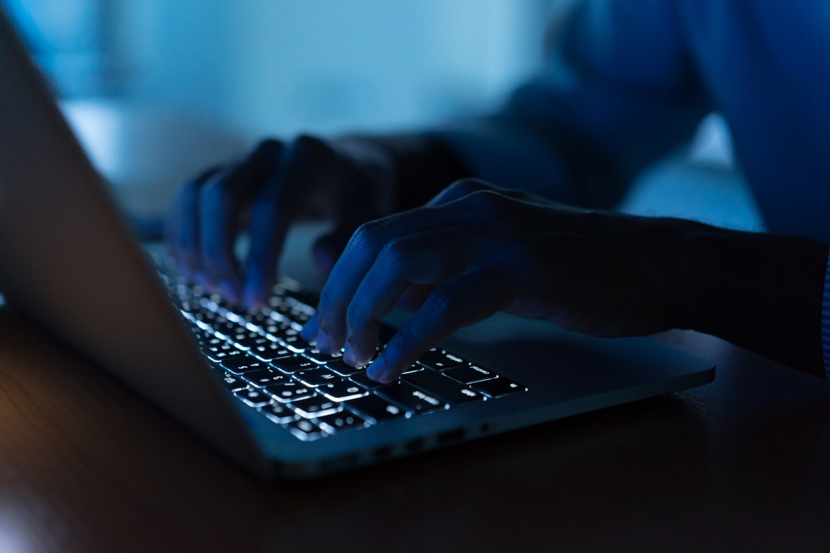 cyber insurance laptop in the dark