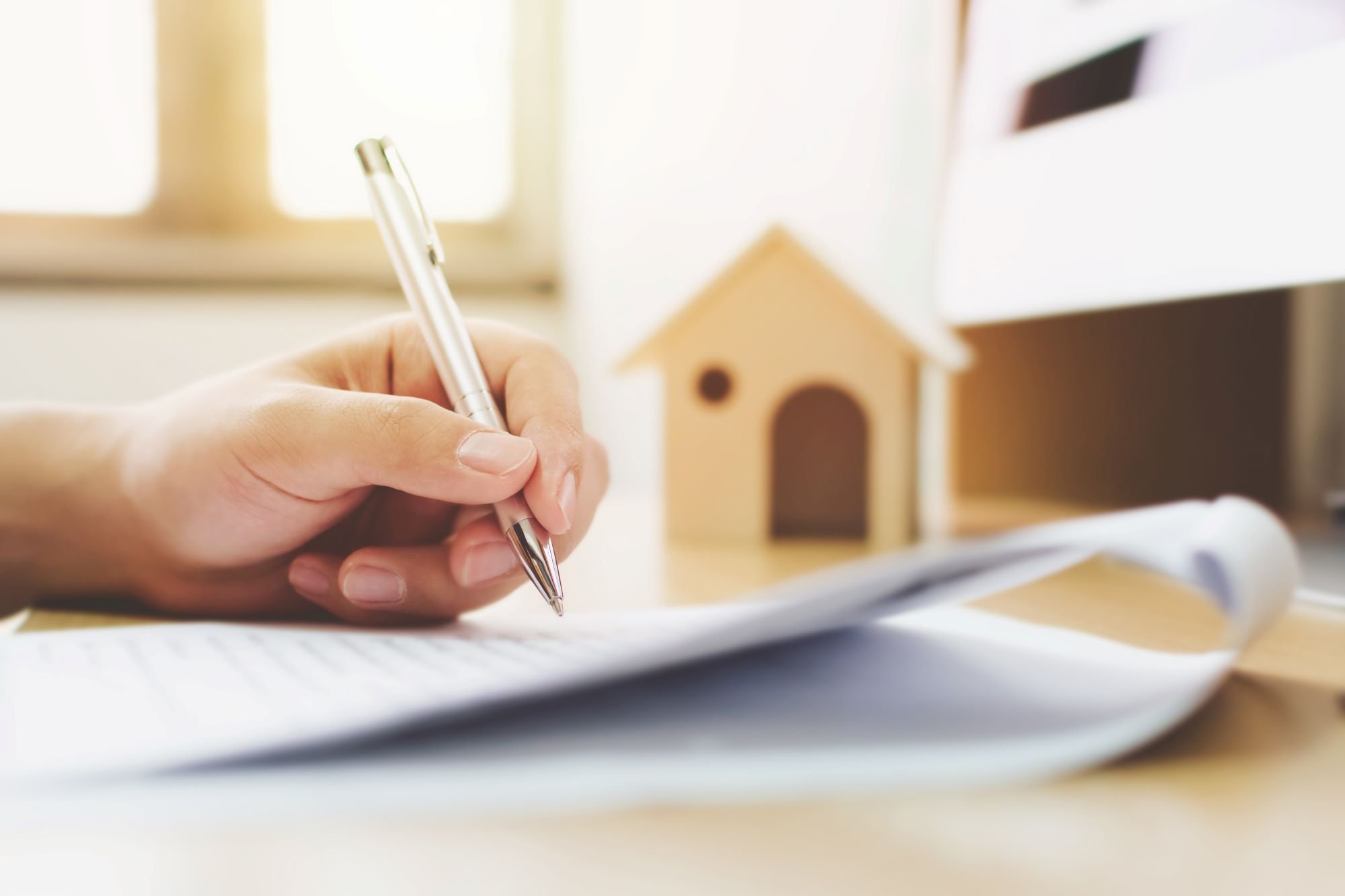 Signing papers relating to a house