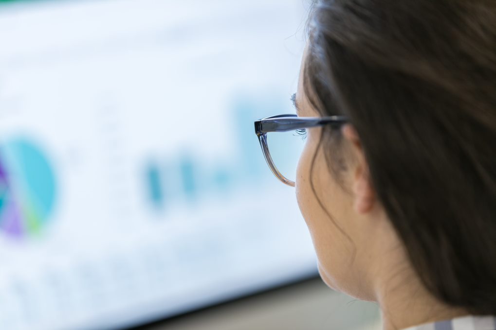 woman viewing blurred out data