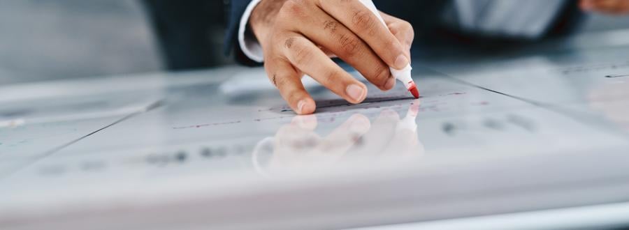 Businessman writing on a whiteboard