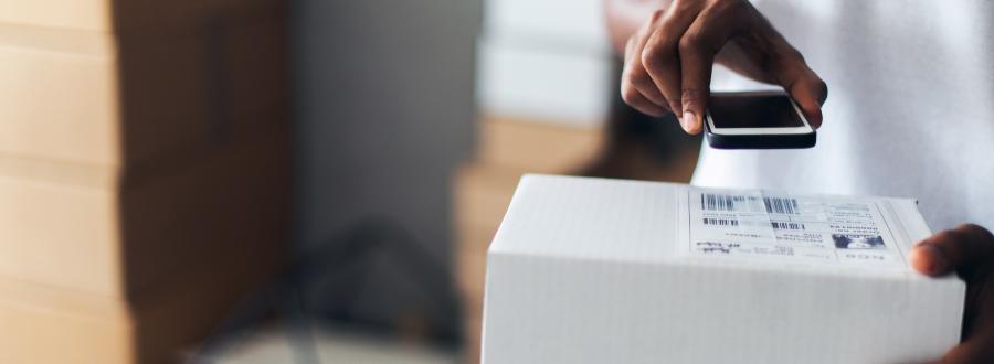 business owner scanning parcels using technology