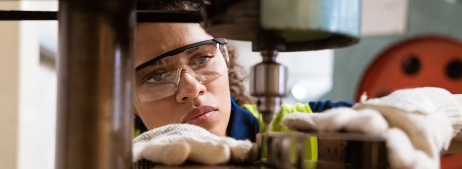 A woman working with machinery