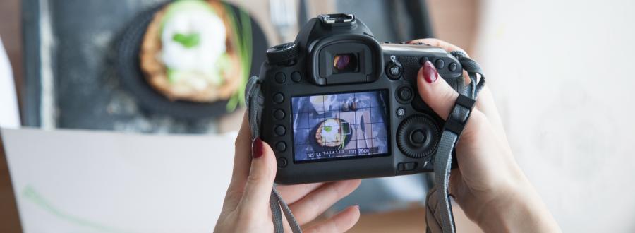 A person takes a picture of their food