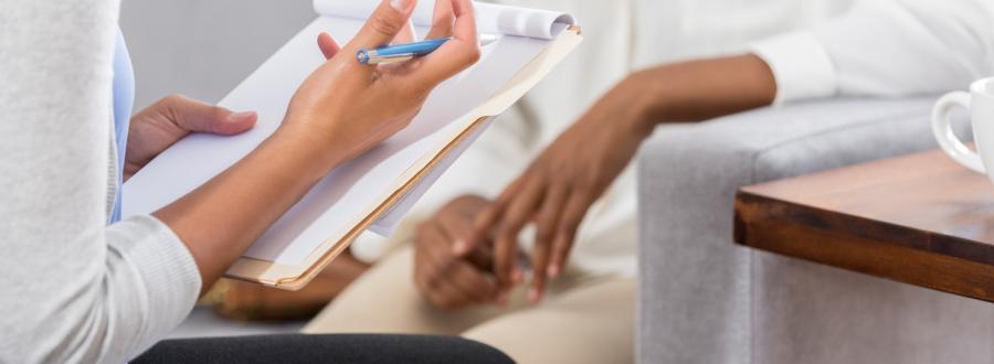 reflexology patient and practitioner in consultation
