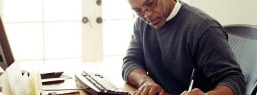 man working at home desk