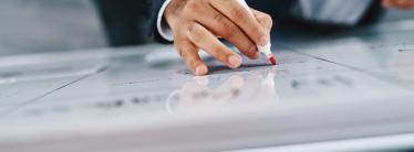 man writing on white board