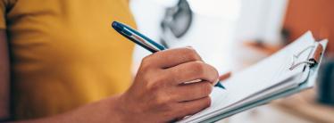 A person going through an inventory list