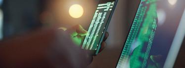 Code on laptop and mobile screen