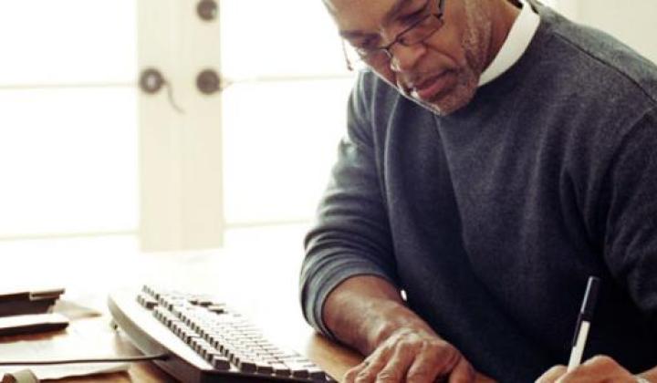 man working at home desk