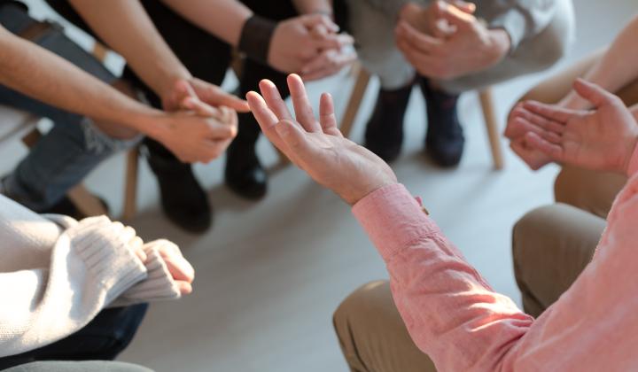 A group of people sat in a circle