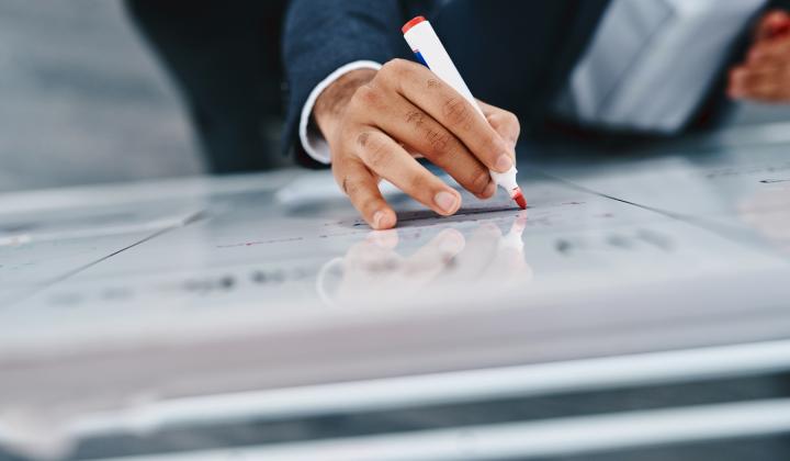 Businessman writing on a whiteboard