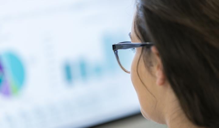 woman looking at computer with data on screen gdpr security