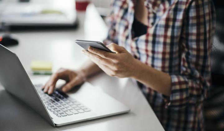 A women on her mobile phone and laptop