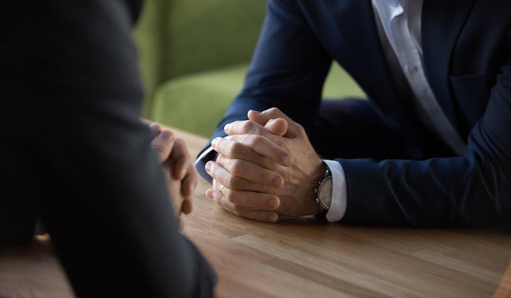 image showing close up of hands during business interview