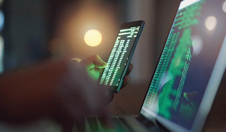 Code on laptop and mobile screen
