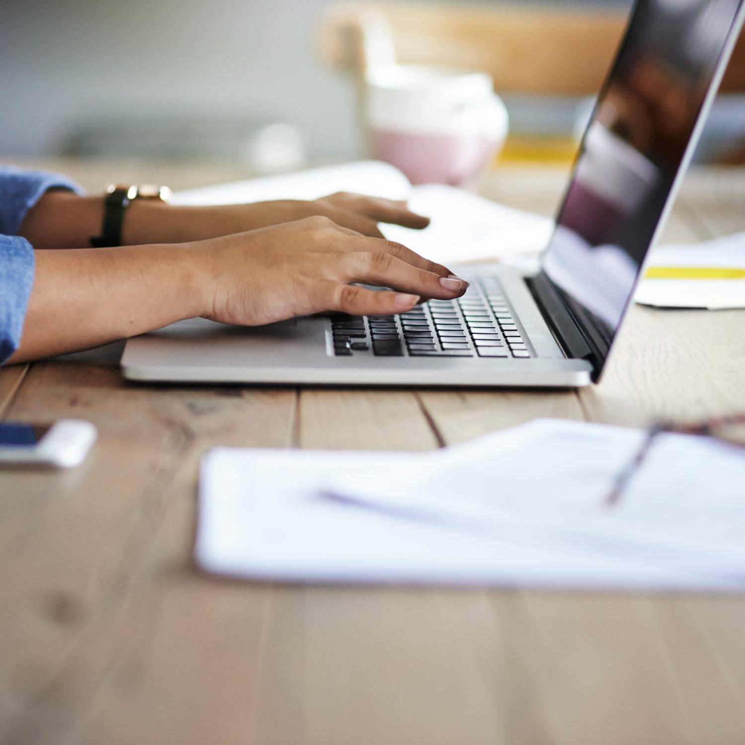 image showing publishing professional working at laptop