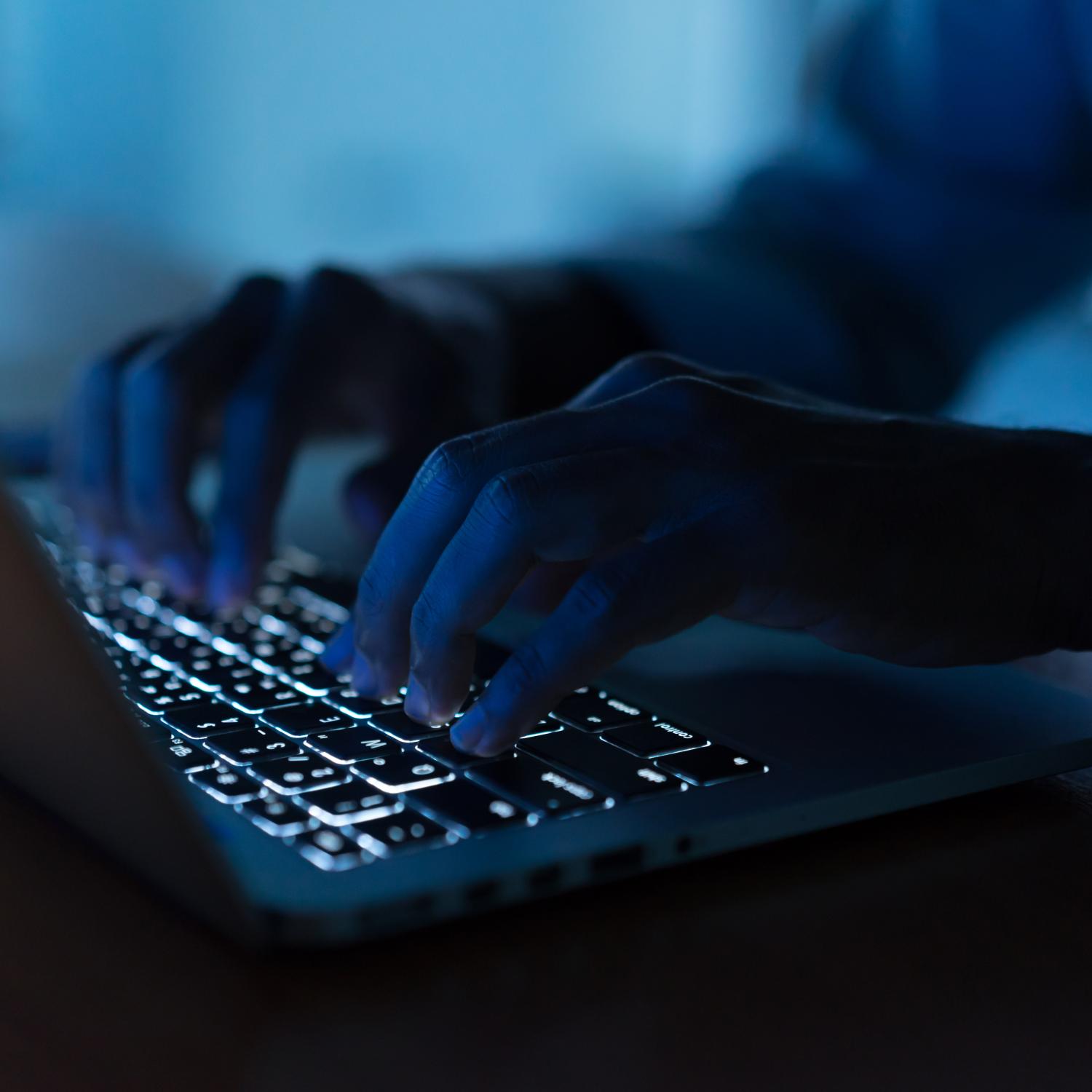 close up image of someone typing at laptop 