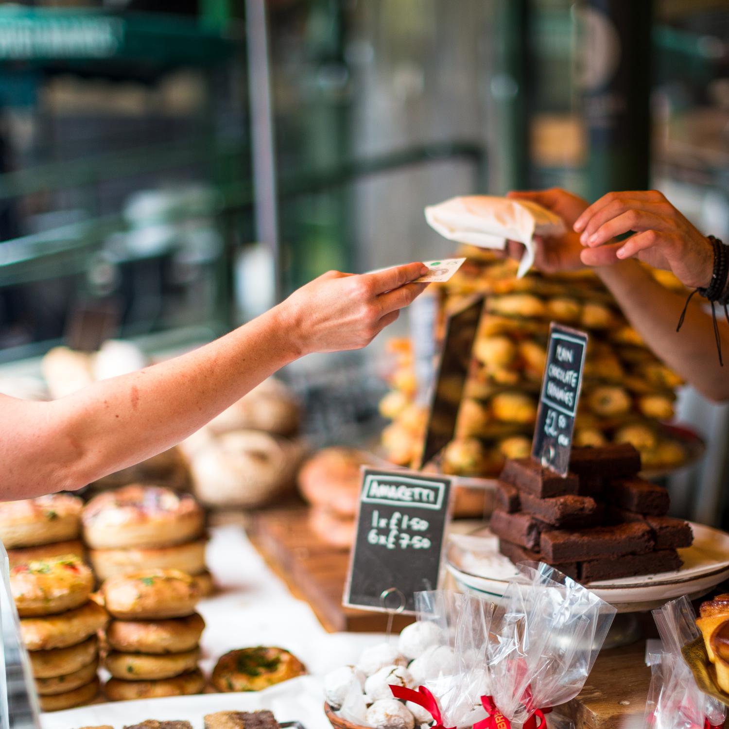 Customer paying for goods at a bakery