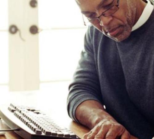 man working at home desk