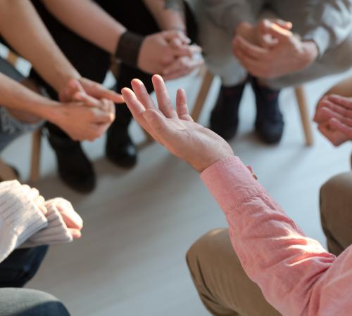 A group of people sat in a circle