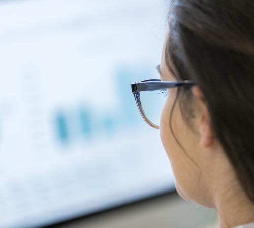 woman looking at computer with data on screen gdpr security