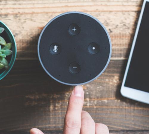voice search device on table next to phone