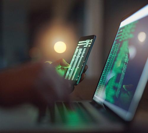 Code on laptop and mobile screen