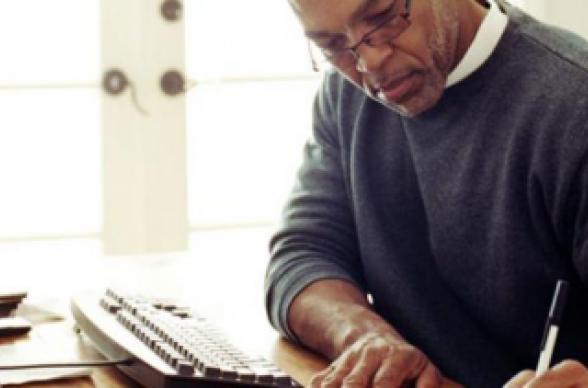 man working at home desk