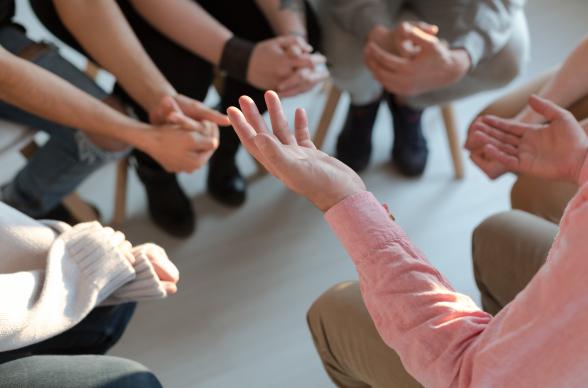 A group of people sat in a circle