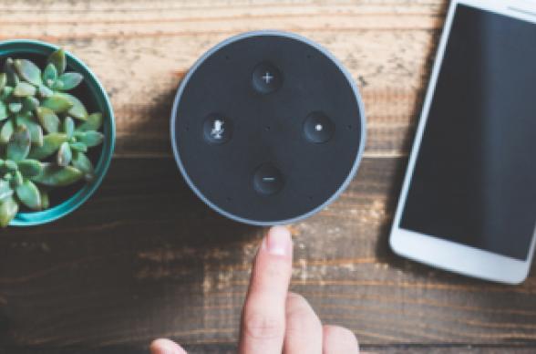 voice search device on table next to phone