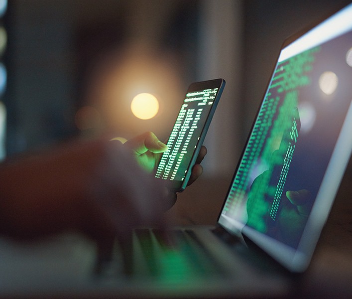 A developer looking at code on their screen