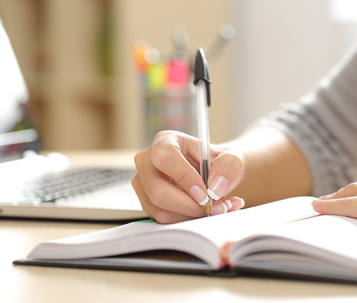 A business owner writing notes