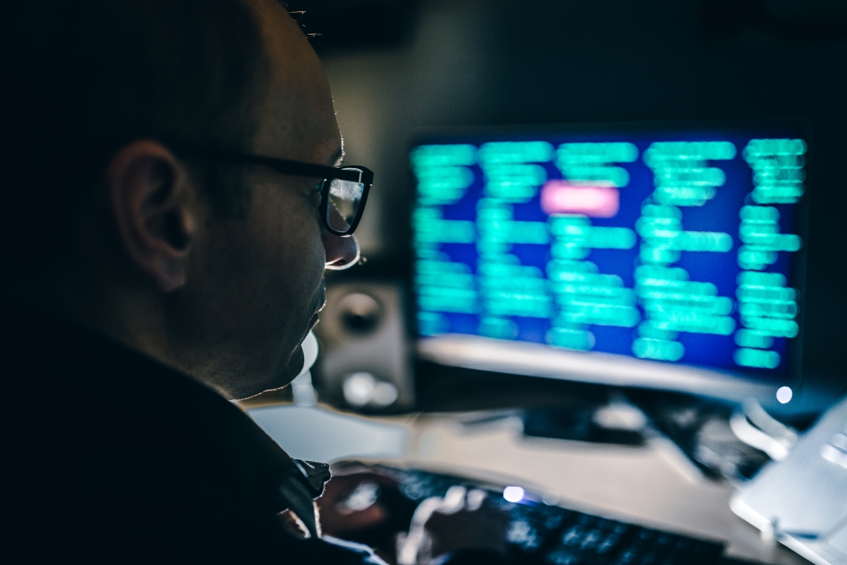 cyber insurance man looking at screen
