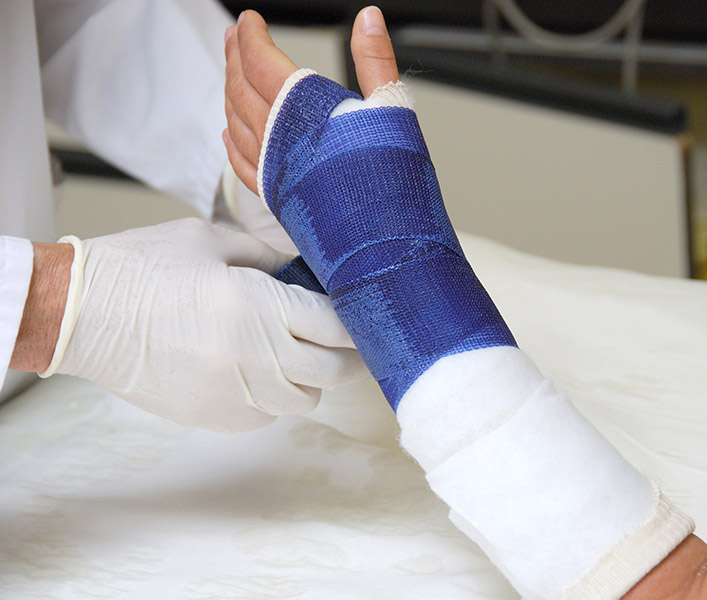 Someone having a cast put on their hand