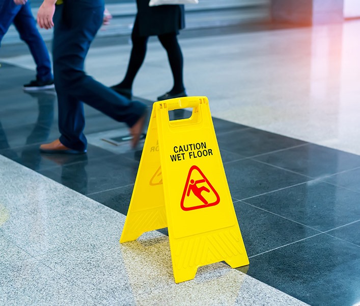 wet floor sign on tiled floor