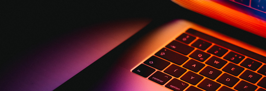 laptop keyboard in pink hue