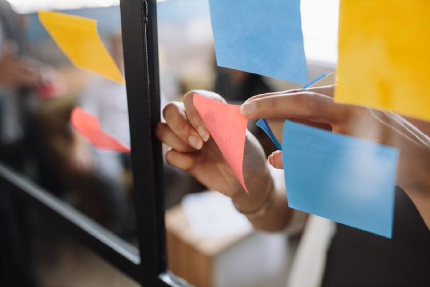 sticky notes on glass advertising agency meeting door