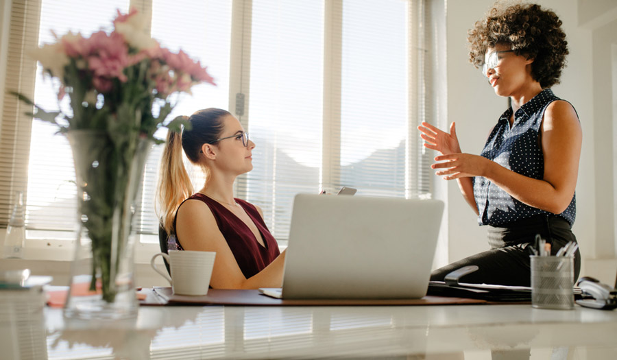 Women Speaking in Office