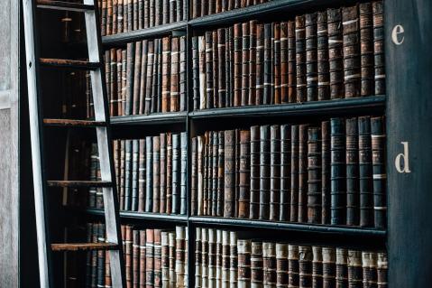Antique collection of books on bookshelf