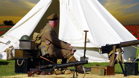 soldier in front of tent