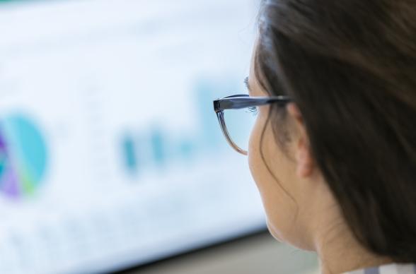 woman looking at computer with data on screen gdpr security
