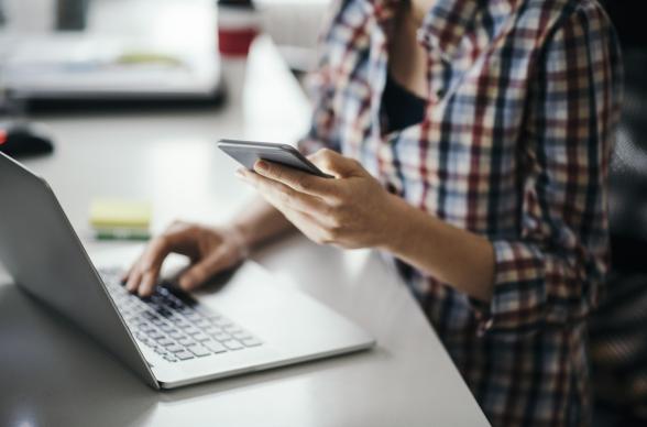 A women on her mobile phone and laptop