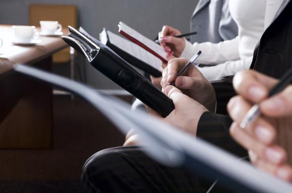 meeting with people writing notes on paper