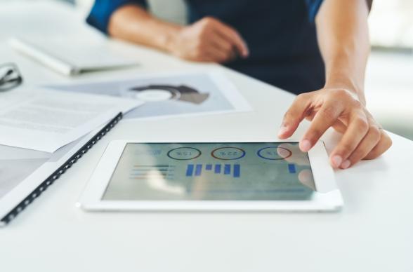 SME founder runs analytics using tablet