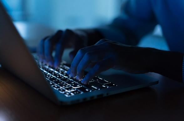 entrepreneur works at a laptop late at night